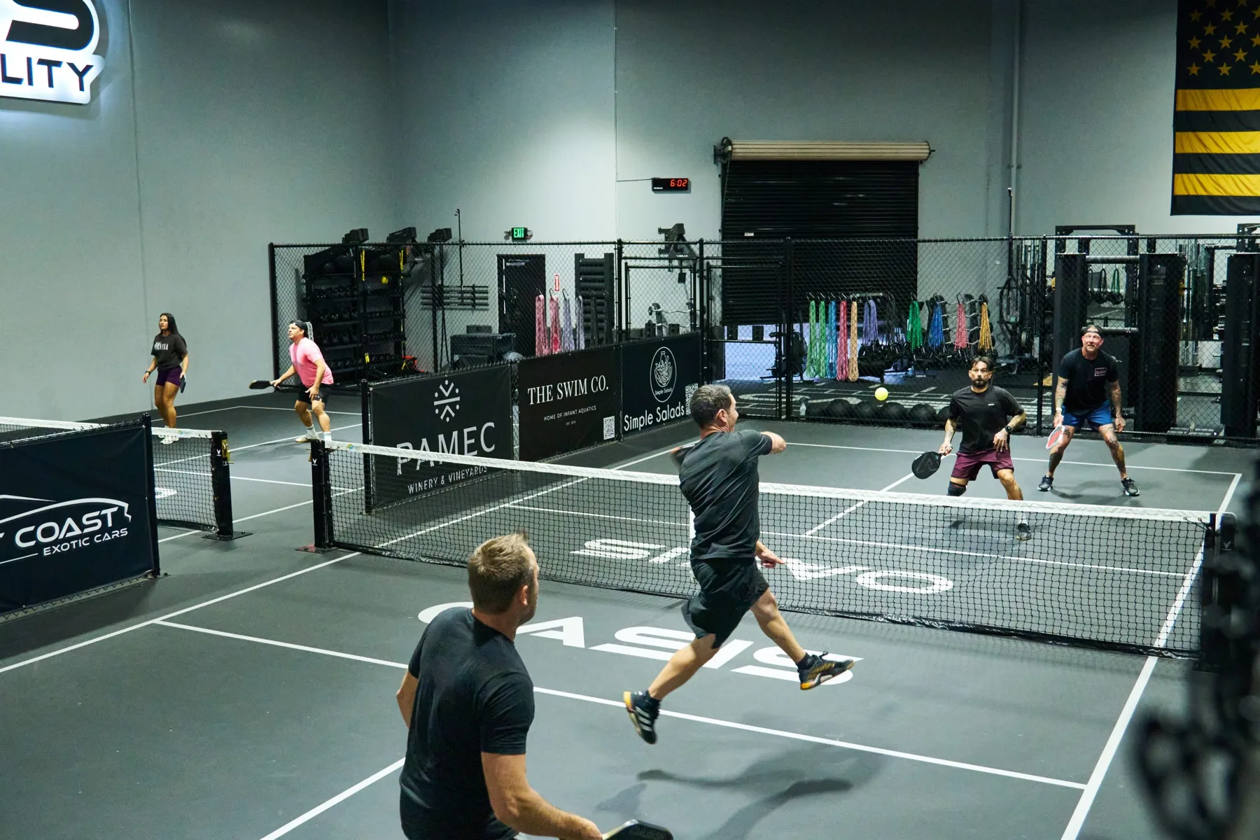 Players enjoying indoor pickleball at Oasis