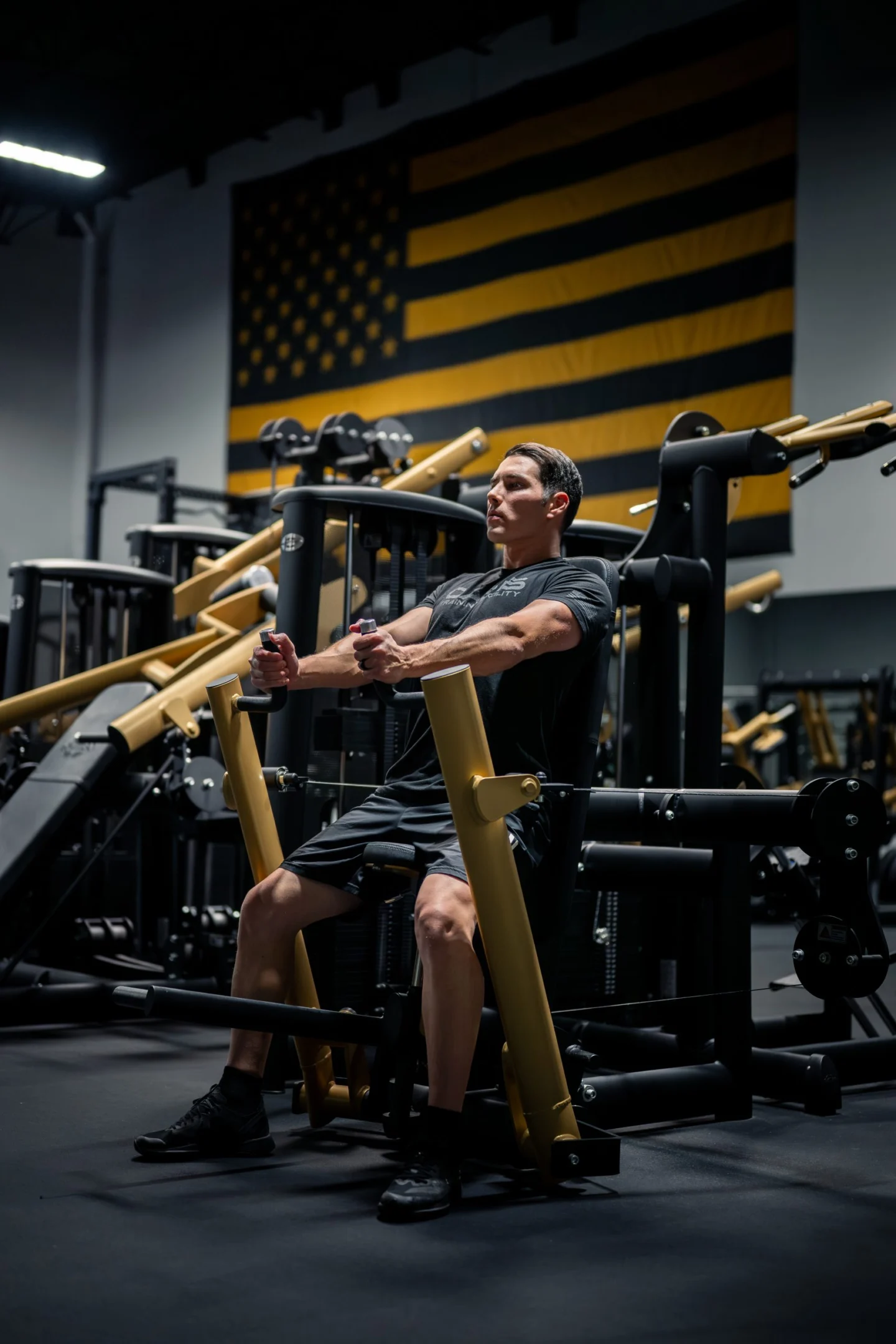 The Oasis CEO training on gold strength equipment at Oasis Training Facility